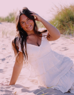Myla Jane in white dress at the beach